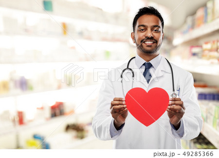 smiling indian male doctor with red heart shape 49285366