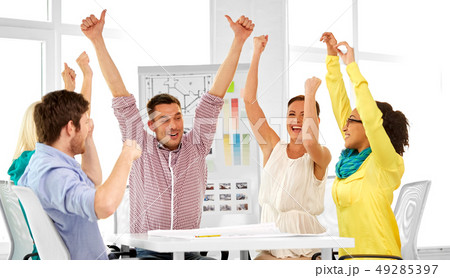 happy creative team or designers at office 49285397
