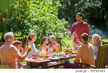 happy family having dinner or summer garden party happy family having dinner or summer garden party 49285463