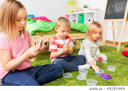 children with modelling clay or slimes at home children with modelling clay or slimes at home 49285464