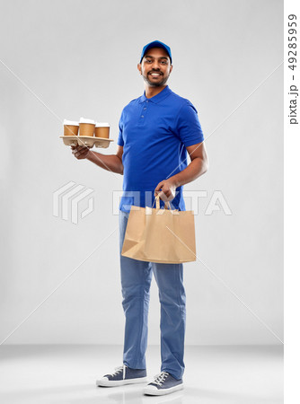 happy indian delivery man with food and drinks happy indian delivery man with food and drinks 49285959