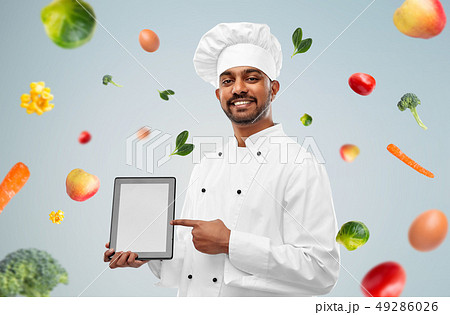 happy male indian chef with tablet computer happy male indian chef with tablet computer 49286026