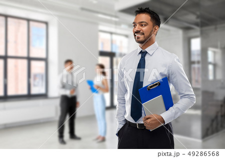 indian businessman or realtor in empty office room 49286568