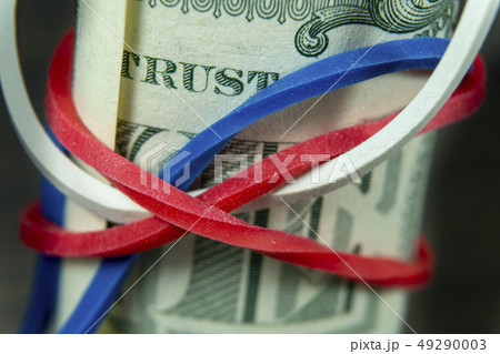 Roll of USD bills with red, white and blue band 49290003