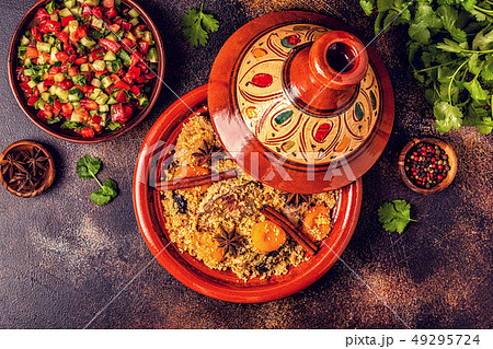 Traditional moroccan tajine of chicken with dried 49295724