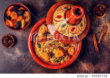 Traditional moroccan tajine of chicken with dried 49295728