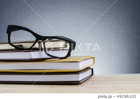 Education concept, spectacles on stack of books Education concept, spectacles on stack of books 49296102