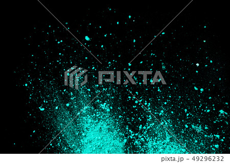A splatter of green blue colored pigment powder. 49296232