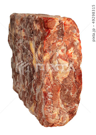 Frozen block of beef on a white background. 49298315