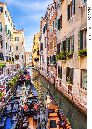 Narrow beautiful street with parked gondolas, 49299544