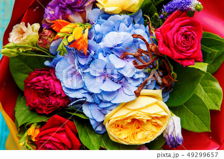 Close-up photo ofp bouquet of multi-colored roses. Close-up photo ofp bouquet of multi-colored roses. 49299657