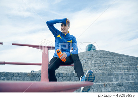 Man on city background at morning. Healthy lifestyle concept. Man on city background at morning. Healthy lifestyle concept. 49299659
