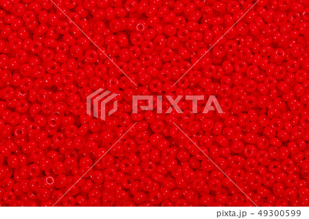 Many red glass beads. Photo beads for background. 49300599