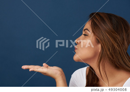 Young woman send blowing kiss Young woman send blowing kiss 49304008