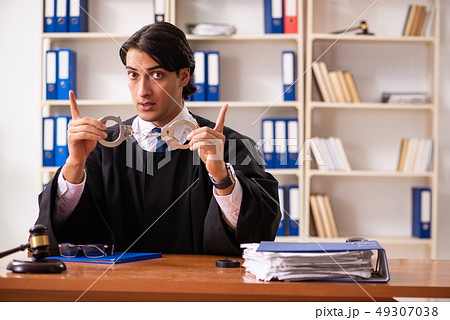 Young handsome judge working in court Young handsome judge working in court 49307038