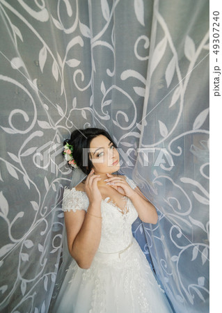 fashion photo of beautiful bride with dark hair in 49307240