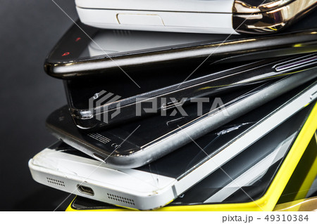 old and broken smartphones and mobile phones  49310384