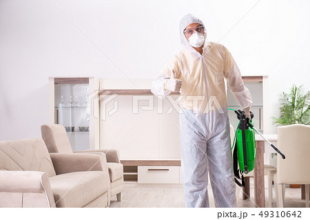 Pest control contractor working in the flat  49310642