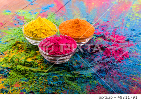 Holi color powder. Organic Gulal colours in bowl for Holi festival