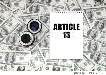 Two photographic lenses and notebook with article 49312905
