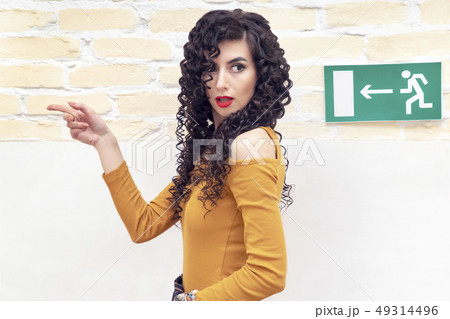 woman shows where the way out 49314496