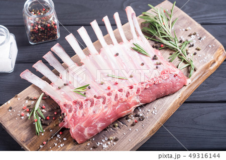 Raw rack of lamb with spices and herbs Raw rack of lamb with spices and herbs 49316144