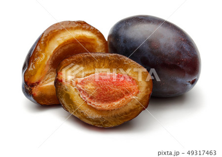Whole and half Damson plums isolated on white 49317463