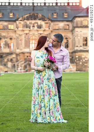 Couple in love on background of palace or mansion Couple in love on background of palace or mansion 49319271