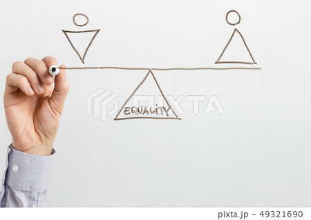 Man drawing seesaw with equal male and female figures Man drawing seesaw with equal male and female figures 49321690