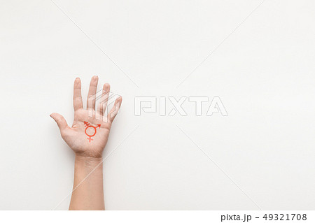 Transgender symbol painted on palm, copy space 49321708