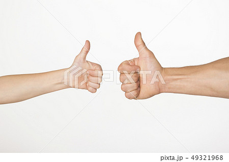 Hands of adult man and child showing thumb up gesture 49321968