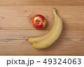 Apple and ripe bananas . 49324063