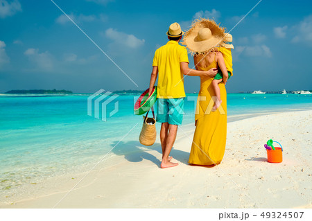Family with three year old boy on beach Family with three year old boy on beach 49324507