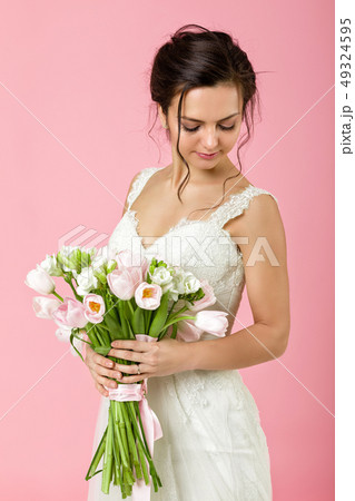 Portrait of beautiful bride with wedding bouquet 49324595