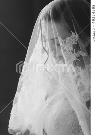 Beautiful bride portrait with veil over face 49324598