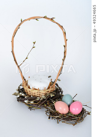 The nest with green, yellow, pink easter eggs The nest with green, yellow, pink easter eggs 49324665