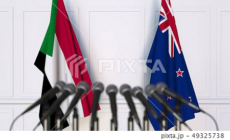 Flags of Sudan and New Zealand at international meeting or negotiations press conference. 3D 49325738
