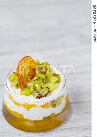 kiwi and peach trifle, appetizing cold dessert 49328299