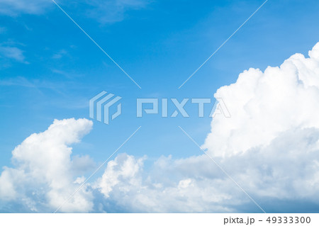 Sparse clouds in blue sky Sparse clouds in blue sky 49333300
