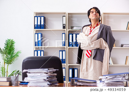 Crazy young man in straitjacket at the office Crazy young man in straitjacket at the office 49334059