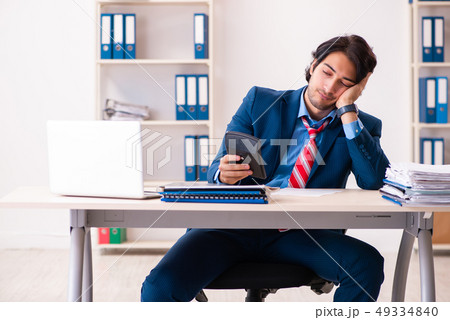 Young handsome businessman sitting in the office  49334840