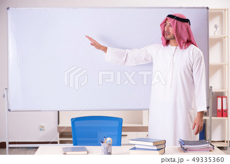 Arab teacher in front of whiteboard Arab teacher in front of whiteboard 49335360