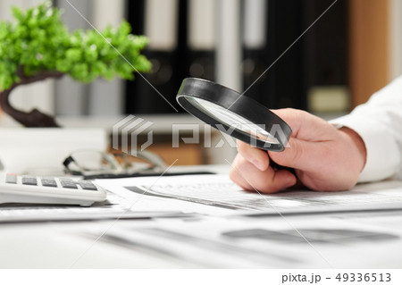 Businessman working in office and calculating Businessman working in office and calculating 49336513