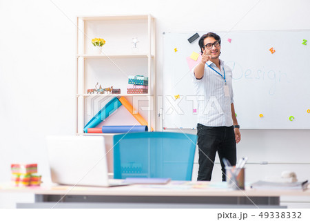 Young handsome male designer working in the office  49338332