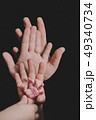 hands of whole family. Father, mother, son and a baby. Friendly happy family 49340734