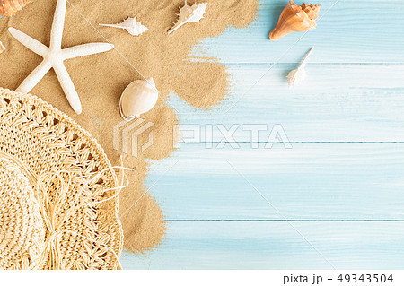 Top view of sea straw hat and sea shells Top view of sea straw hat and sea shells 49343504