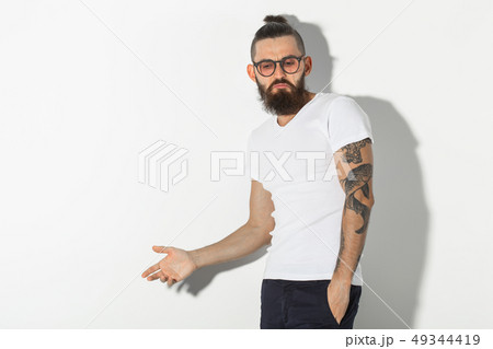 hipster, people concept - Tattooed bearded man in white shirt isolated on white background 49344419