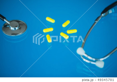 Pharmacy and pills. Medicines, Supplements and Drugs in a Bottle on Blue Background 49345701