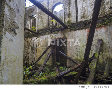 Abondoned ruin of historical villa house in tropical forest on footpath hiking trail near Furnas 49345704