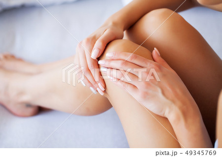 Knee Pain. Unhappy Woman Suffering From Pain in Leg at Home 49345769